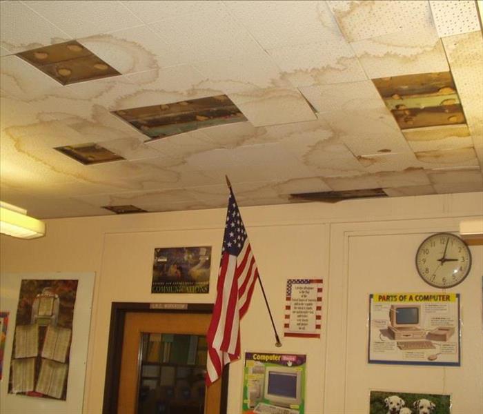 school classroom with water damaged ceiling